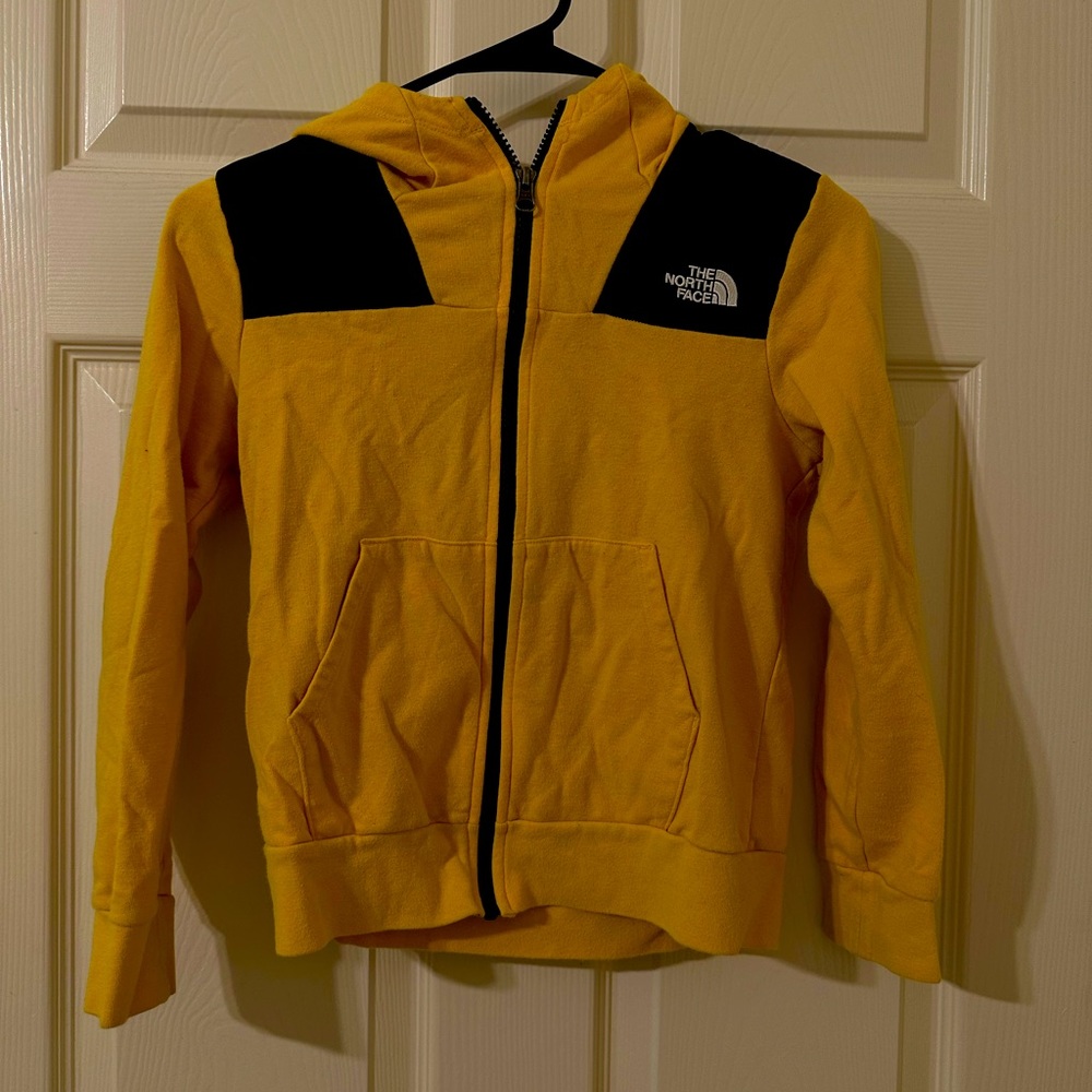The north face kids zip up jacket. Black and yellow. Size small 7-8